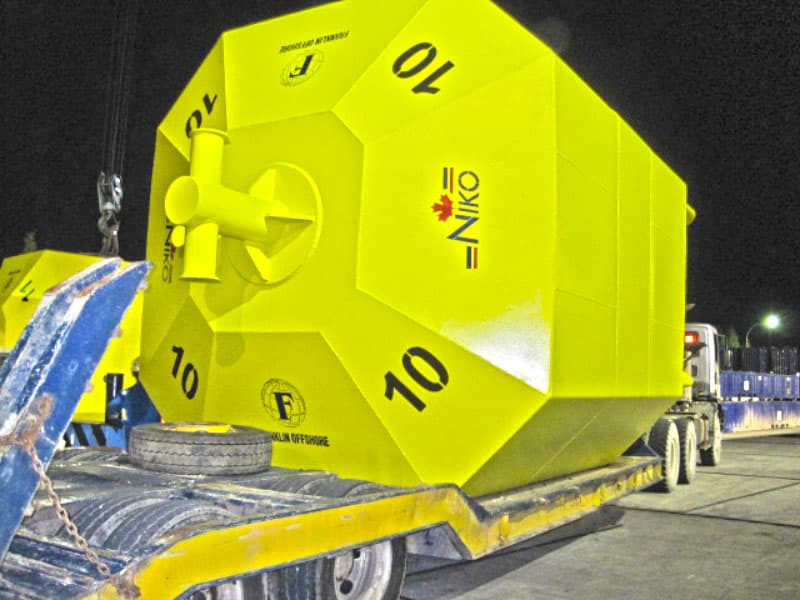 Mooring buoy loaded onto a low-bed trailer